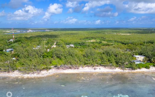 TRANQUIL BEACHFRONT ACRE PARCEL- REEF PROTECTED WITH WHITE SAND